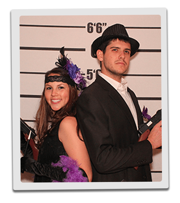 Minneapolis Murder Mystery party guests pose for mugshots
